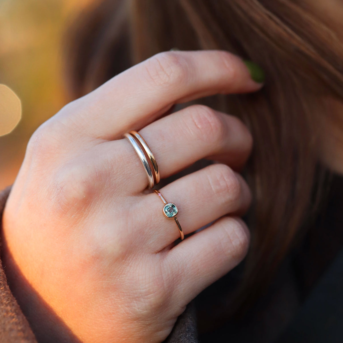 hand wearing handmade rings