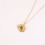18k gold necklace with green gemstone amulette