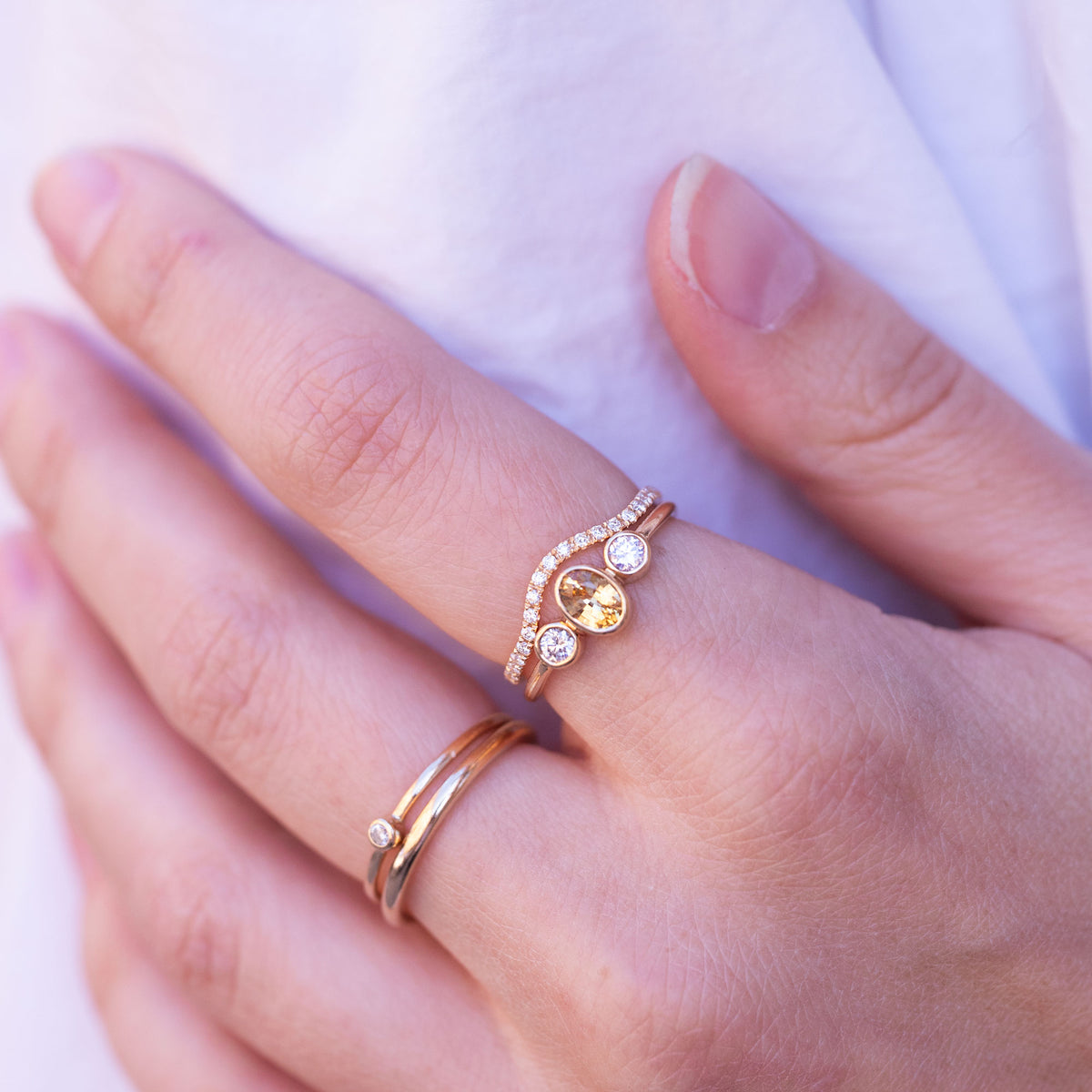 hand wearing diamond rings