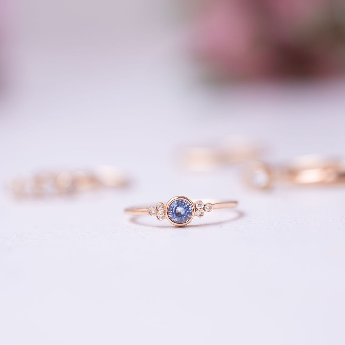blue sapphire and diamond set on a thin gold ring