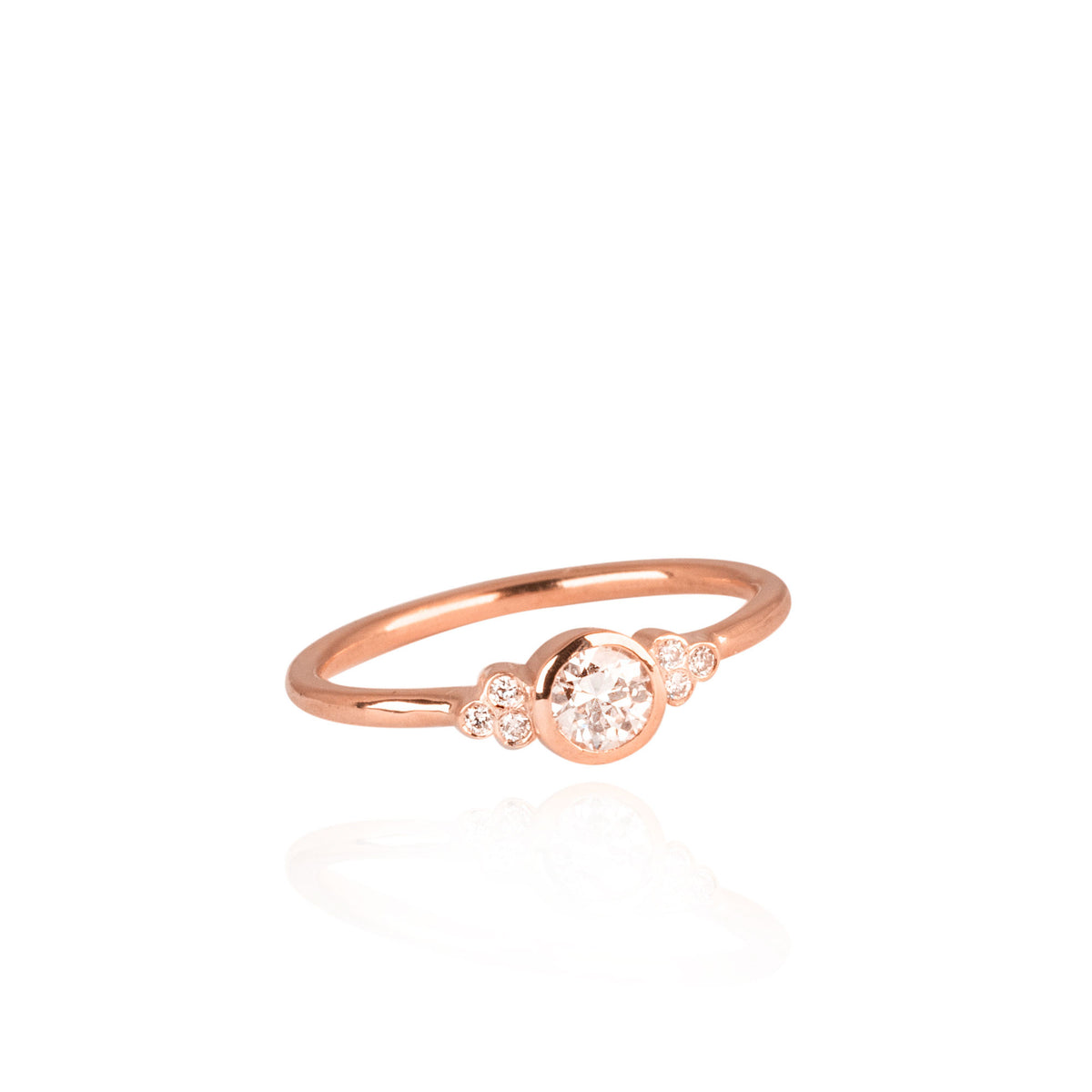 0.25ct brilliant cut diamond with smaller diamonds on the side, engagement ring