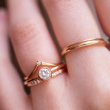 wedding ring stack with diamonds on hand