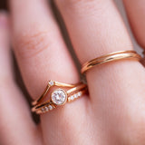 wedding ring stack with diamonds on hand