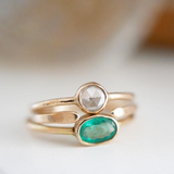 Emerald and diamond ring stacked together