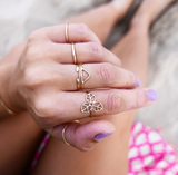 hand with plenty of gold rings