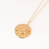 18k gold necklace with pendant showing moon and diamond star