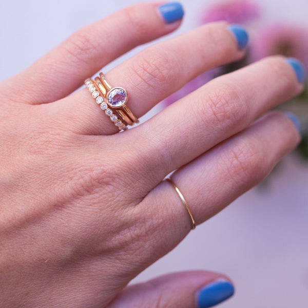 gold rings on hand, diamonds and sapphire