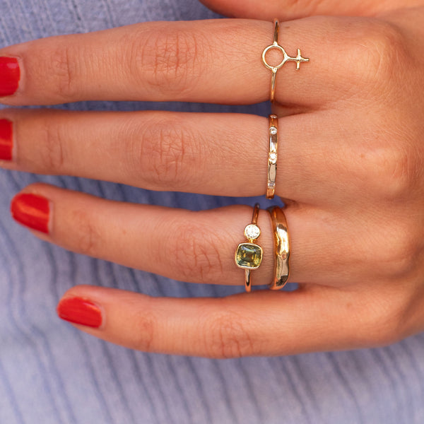 hand with fine jewelry rings, solid 18k gold