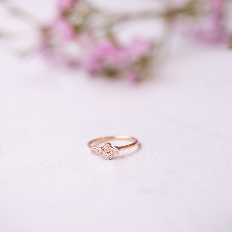 handmade gold ring with four tiny diamonds