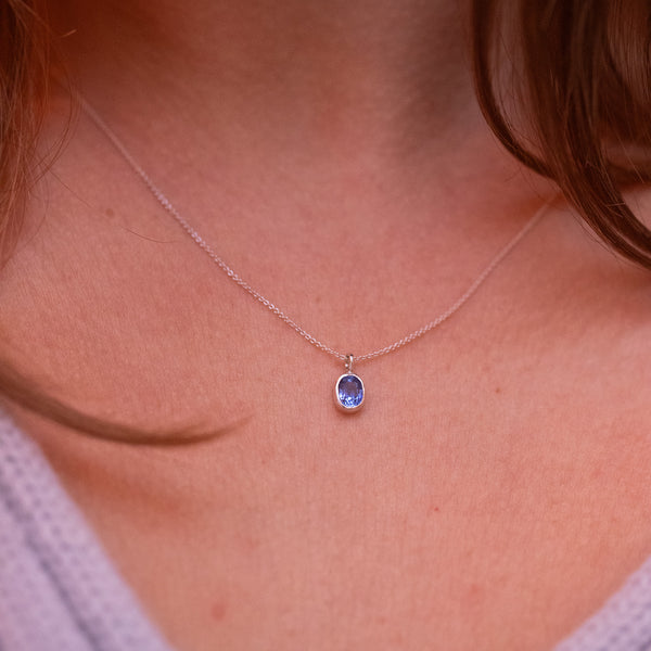 silver sapphire necklace on model