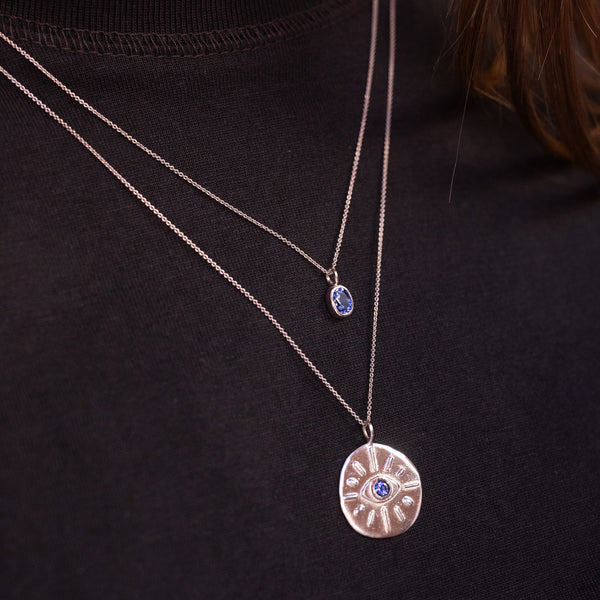 silver necklaces with blue sapphire pendants