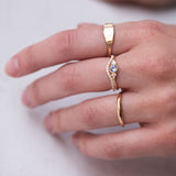 hand wearing handmade gold rings