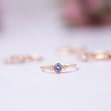 blue sapphire and diamond set on a thin gold ring