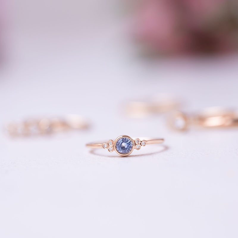 blue sapphire and diamond set on a thin gold ring