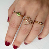 gold rings with diamond and green sapphire