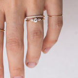 hand with gold diamond rings