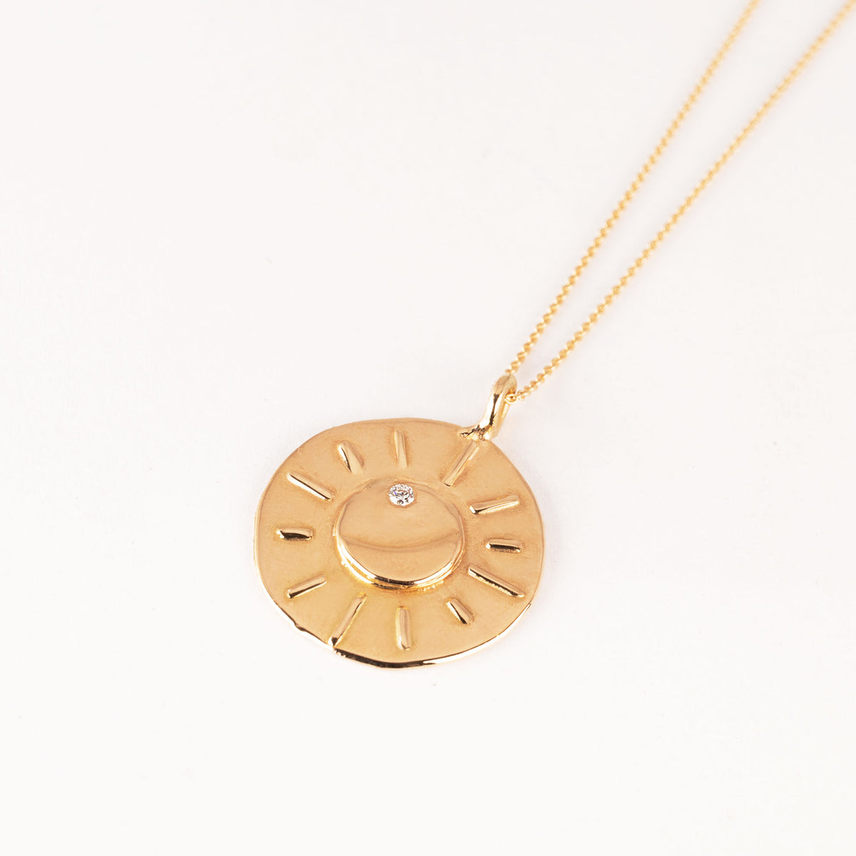 18k gold necklace with pendant showing moon and diamond star 